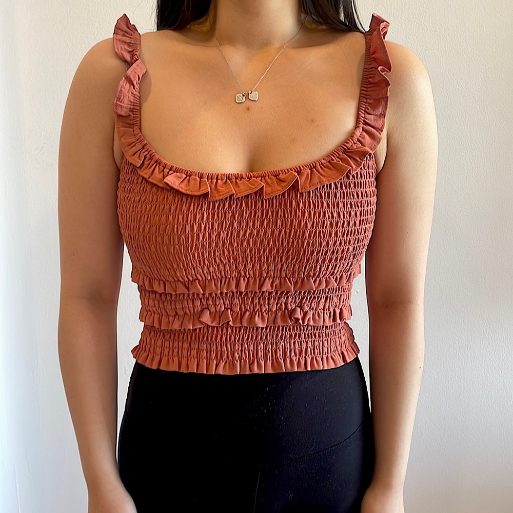 Grapefruit colored ruffle tank top in size 0